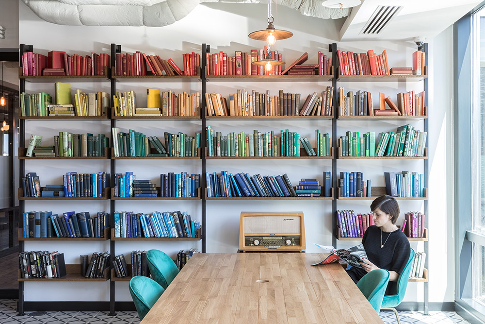 Colour co-ordinated bookshelves at Mindspace Shoreditch