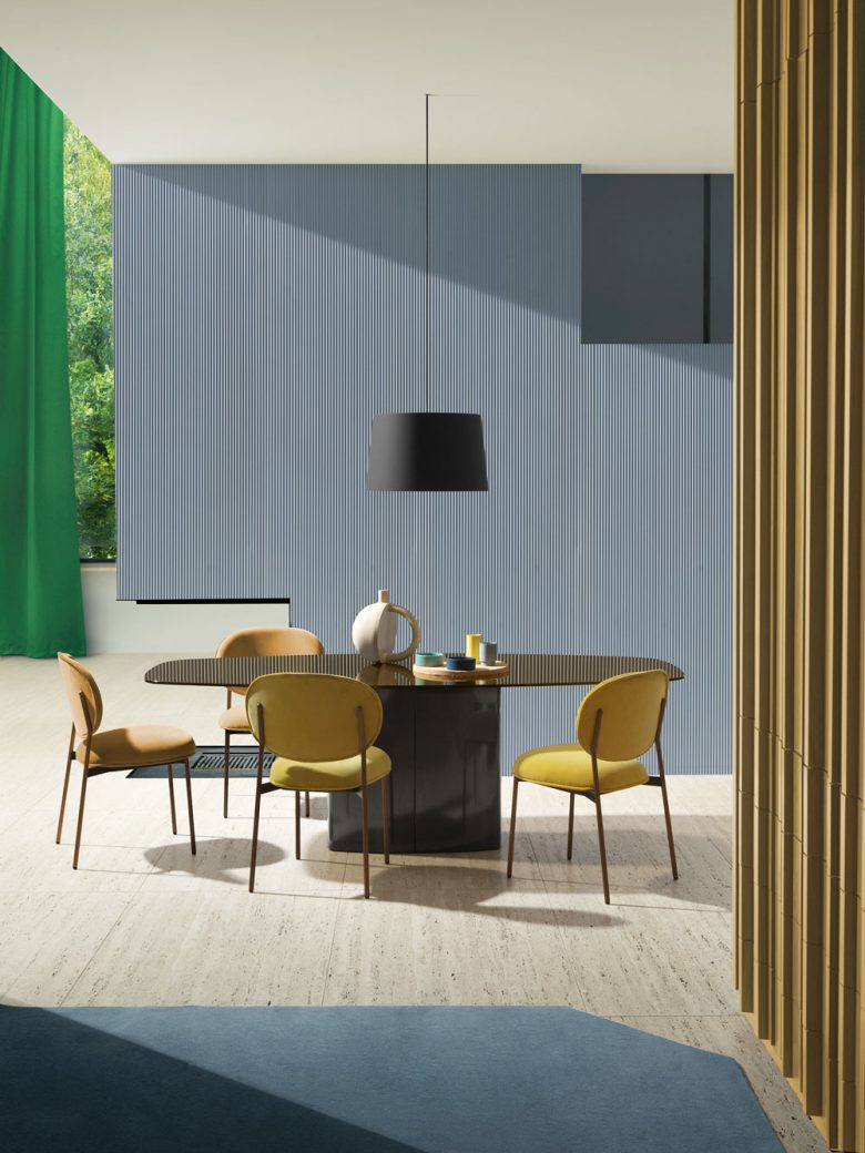Pedrali blume chairs arranged around table in hospitality setting