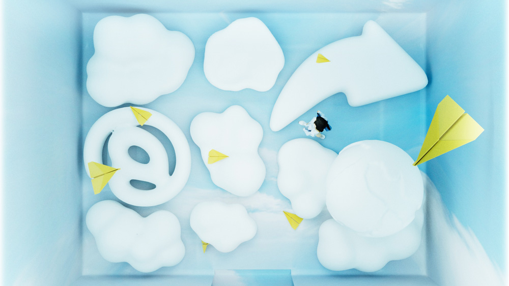 Woman walks through inflatable clouds at the Is email dead? a new design museum exhibition
