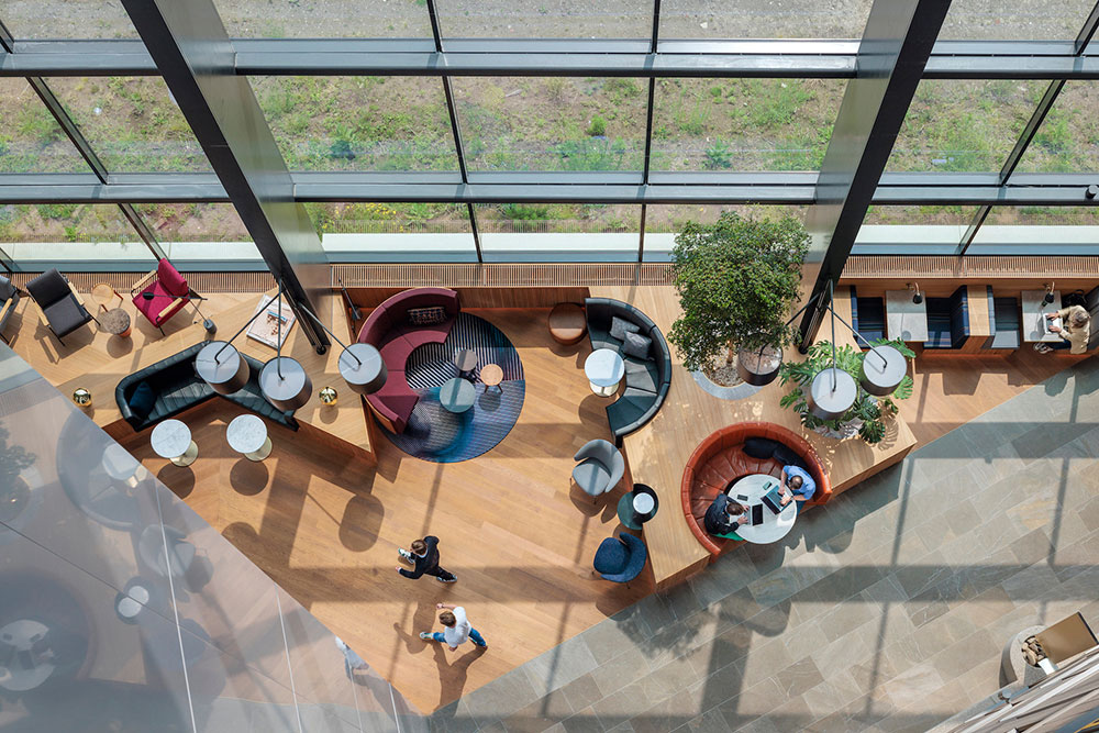 tripolis-park-atrium-concrete-amsterdam-business-district-workplace-design-booth-seating-plan-view