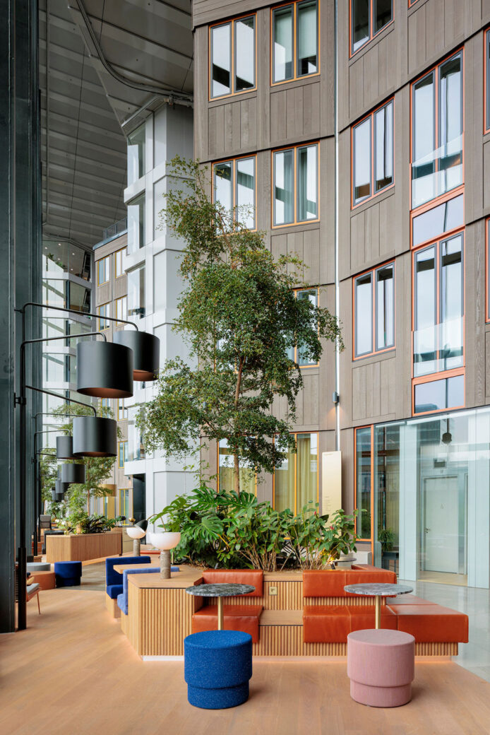 tripolis-park-atrium-concrete-amsterdam-business-district-workplace-design-soft-seating-stools-and-planting